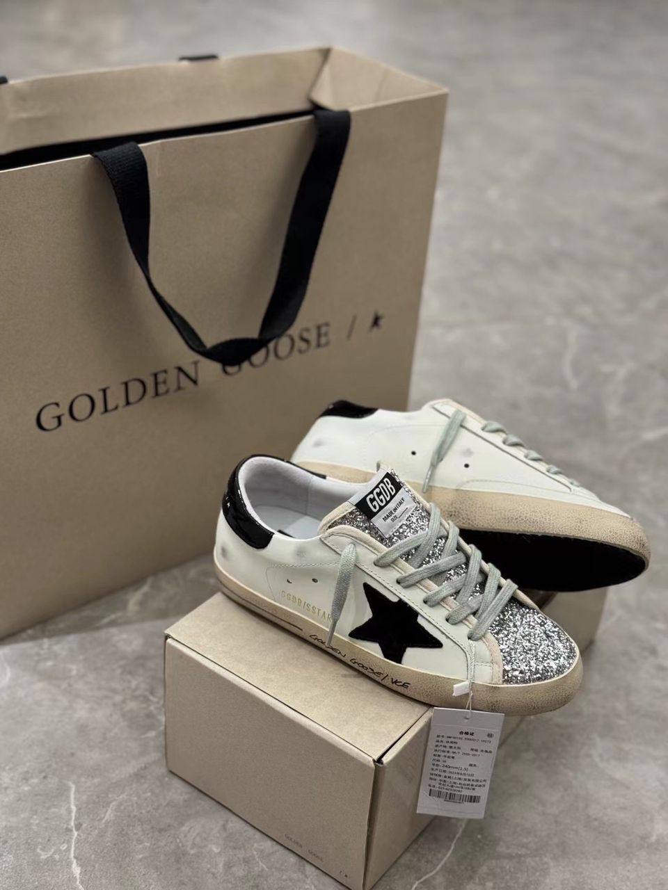 Super-Star women's sneakers in white, black, and silver glitter