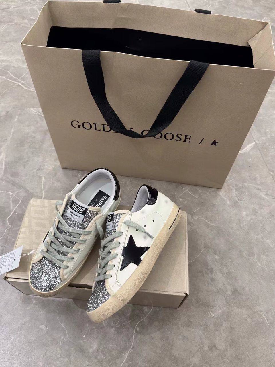 Super-Star women's sneakers in white, black, and silver glitter