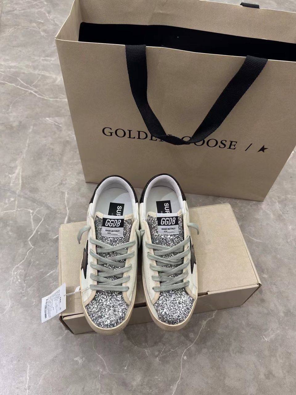 Super-Star women's sneakers in white, black, and silver glitter