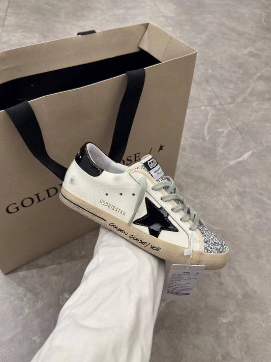 Super-Star women's sneakers in white, black, and silver glitter