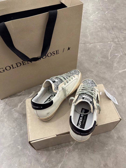 Super-Star women's sneakers in white, black, and silver glitter